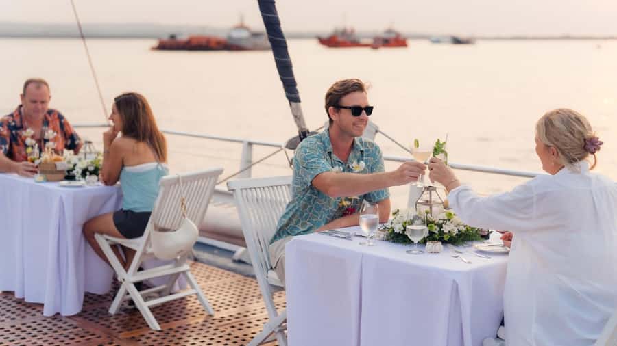 Bali/Benoa: 5-Course Romantic Evening Cruise With Live Music - Boarding at Benoa Harbor with a lei and welcome drink