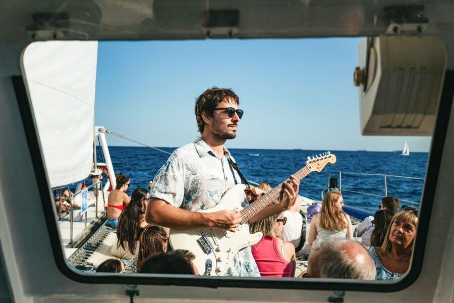 Barcelona: Sunset Catamaran Cruise with Live Music - Sunset views, sea breeze, and what to wear