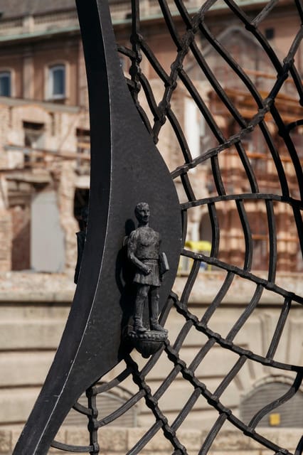Budapest: Buda Castle Walking Tour & Folk Music Performance - Tárnok Street and centuries of building styles