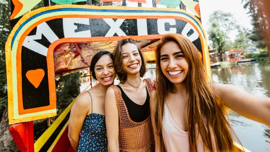 CDMX: Xochimilco Trajinera Party, Drinks, Mariachi & Tacos - Boarding a flower-decorated trajinera