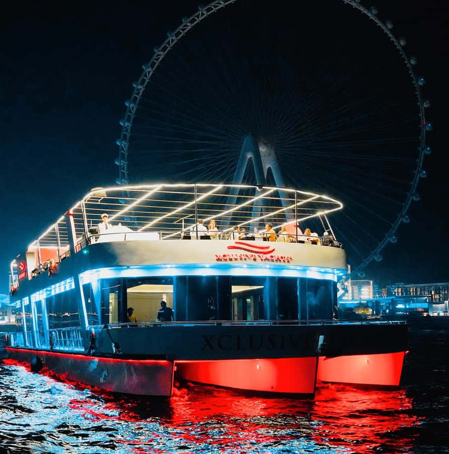 Dubai: Sunset or Dinner Cruise with Live Music & Open Bar - Dubai Marina after sunset, seen from the water