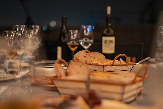 Lisbon: Rooftop Wine Tasting with Live Traditional Fado - Portuguese cheese and charcuterie between the pours