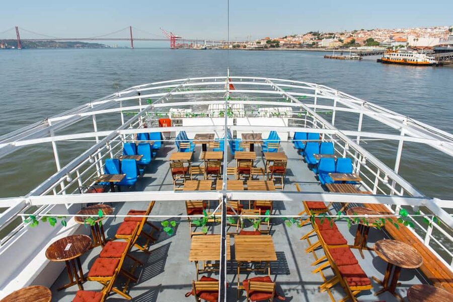 Lisbon: Tagus River Dinner Cruise with Live Jazz - Reading Lisbon’s waterfront from the boat