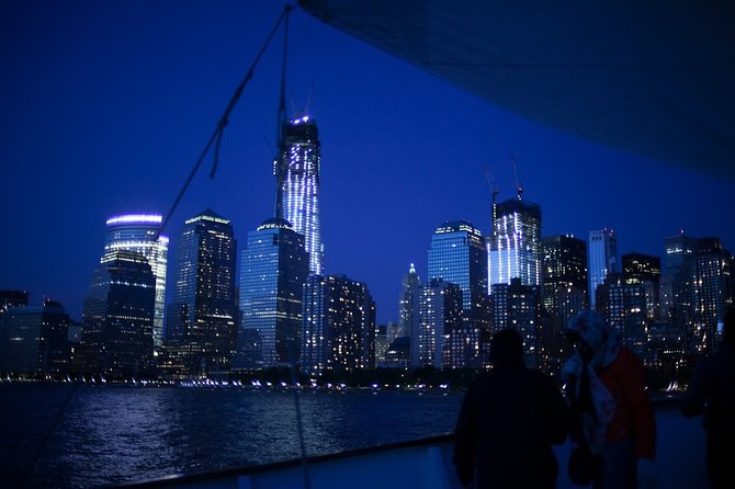 New York City Sunset Jazz Sail aboard Clipper City - The park landmark and Ellis Island