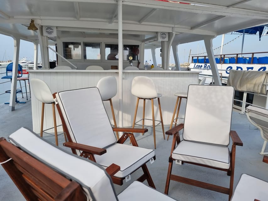 Rhodes: Sunset Cruise with Live Music, Wine & Greek Buffet - A three-hour evening on the east coast