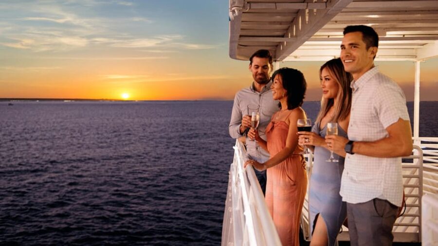 Rhodes: Sunset Cruise with Live Music, Wine & Greek Buffet - Leaving Mandraki with Rhodes landmarks in view