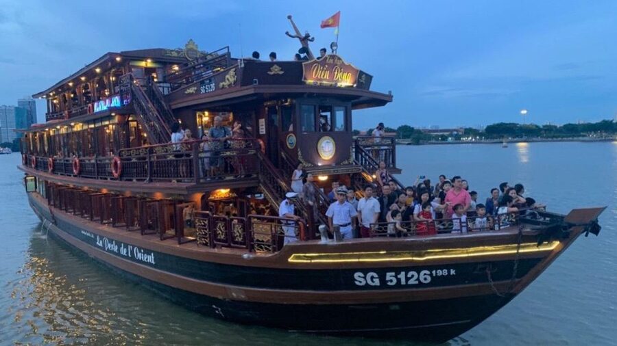 Saigon River Dinner on Cruise with Buffet and live music - Saigon after sunset, seen from the river