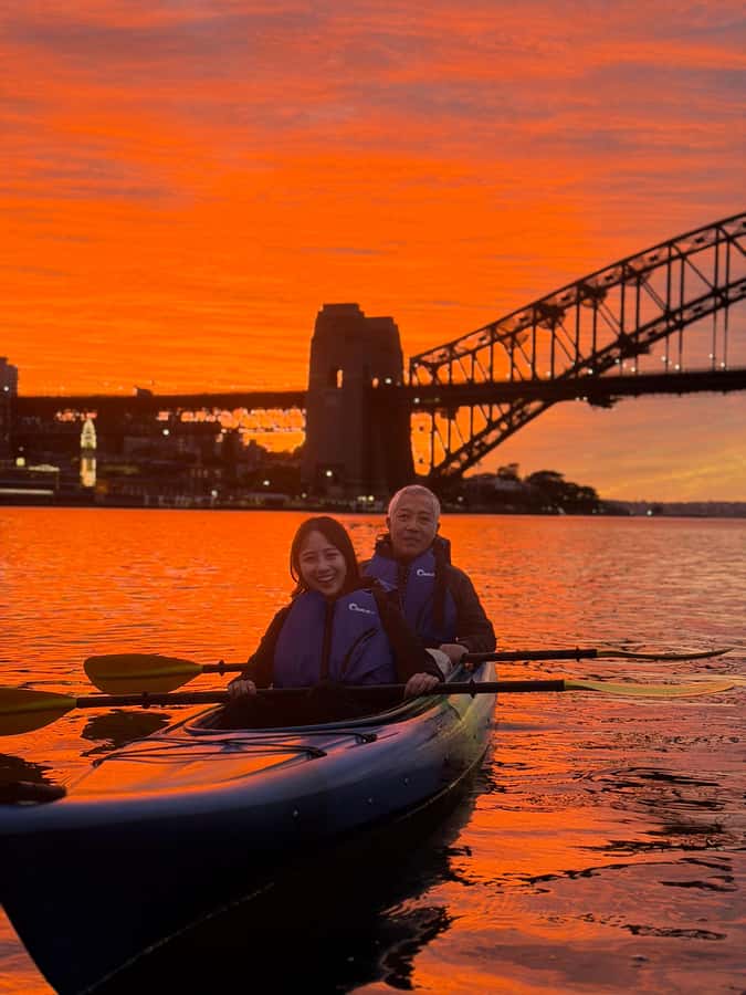 Sydney: Sunset Kayak Tour with Opera House Views - Passing the Harbour Bridge in soft light