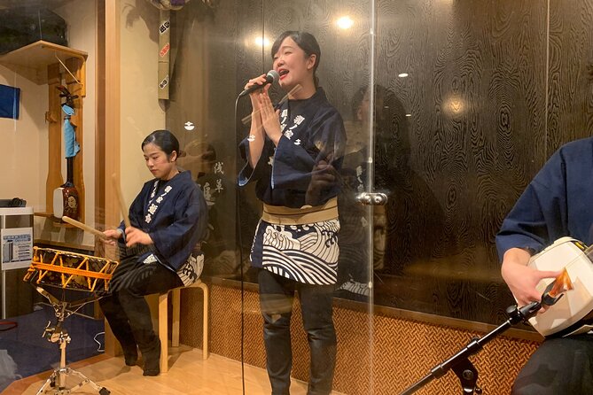 Tsugaru shamisen performance over traditional dinner - Starting above Asakusa at the observation deck