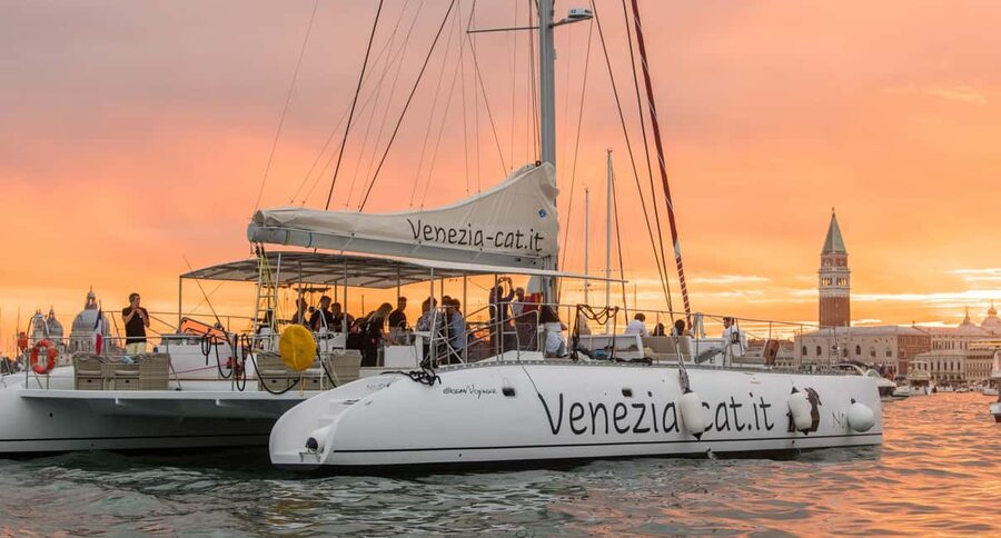 Venice: Golden Hour Cruise with Classical Music & Cocktail - Boarding a spacious catamaran with room to choose your seat